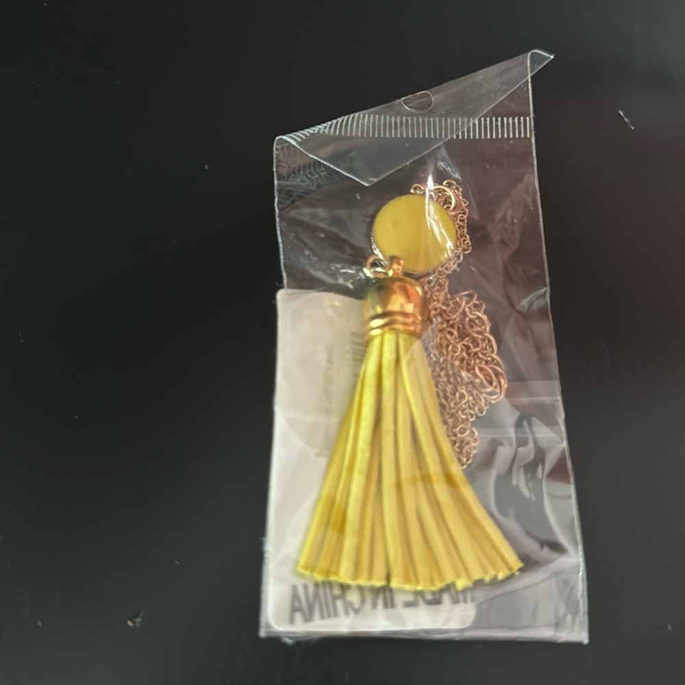 NWT yellow tassel necklace. Gold metal.
